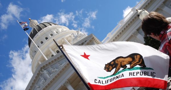 CA capitol building and flag